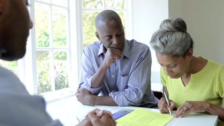 older-couple-looking-at-papers-seriously