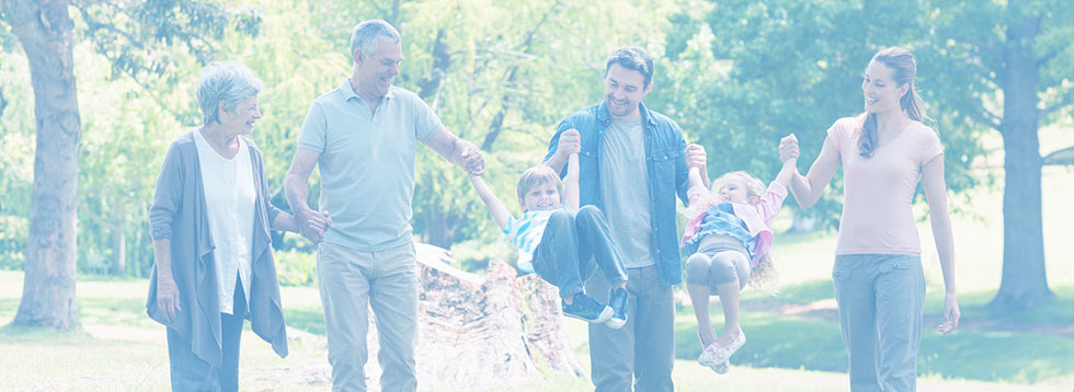 family-with-two-small-children-holding-hands-with-grandparents