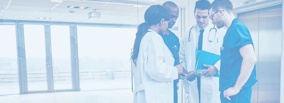 doctors-looking-down-in-at-paper-in-a-circle