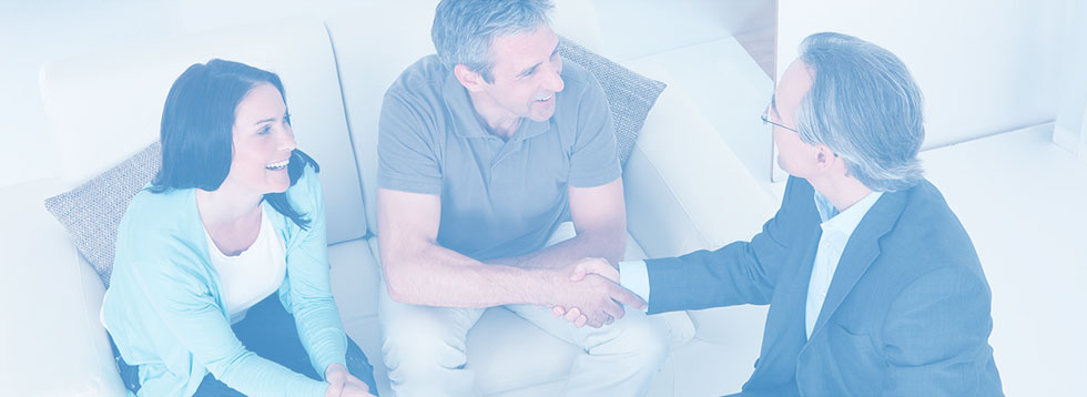 couple-smiling-and-shaking-hands-with-man